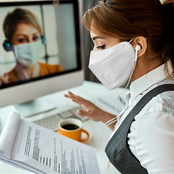 person working in white face mask